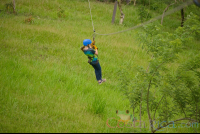 Young Girl Riding A Cable On Blue River Zipline Rincon De La Vieja
 - Costa Rica