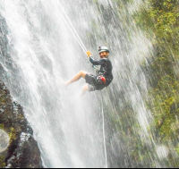 Man Smiling While Rappelling Down Horseback Rapelling Tour Rancho Tropical Matapalo
 - Costa Rica