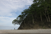 man standing by chora island cliff 
 - Costa Rica