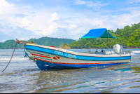 small boat anchored in playa curu curu wildlife refuge 
 - Costa Rica