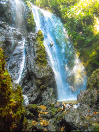 Man Rappelling Down Ventana De Cielo Waterfall
 - Costa Rica